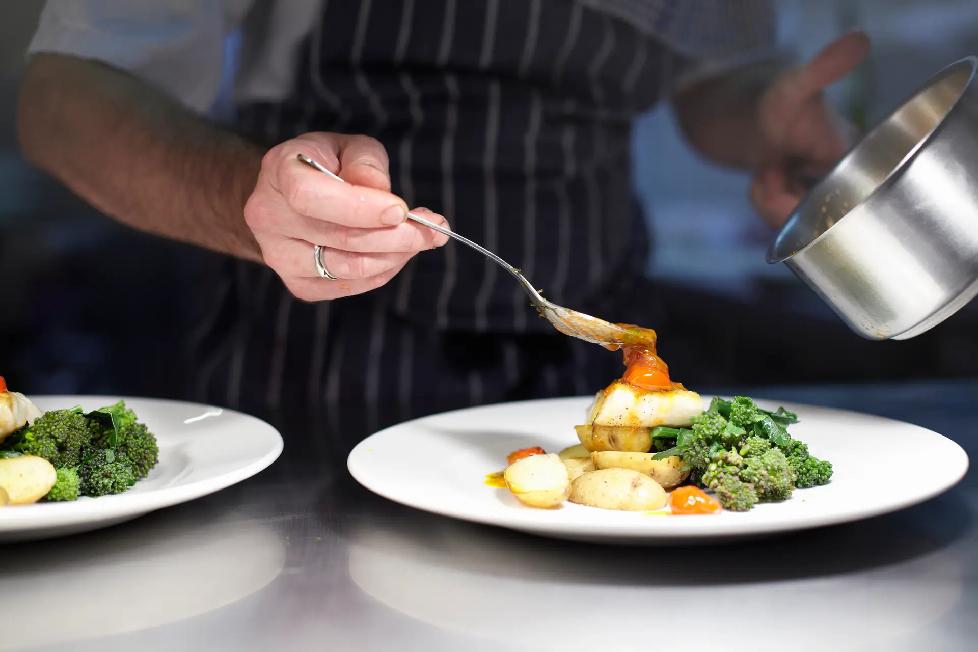 Chef preparing dish in kitchen